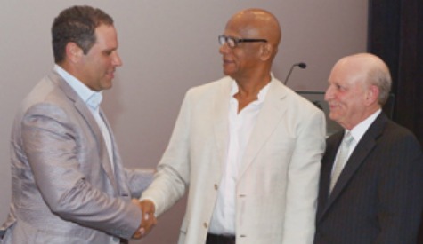 ADD TO DEVELOPMENT: Joseph Rahael, left, developer of the SouthPark complex greets San Fernando Deputy Mayor Junia Regrello at the opening of SouthPark Cinemas 10 at the Tarouba Link Road, San Fernando on Tuesday. Looking on is Robert Carrady, president of Caribbean Cinemas. —Photo: DEXTER PHILIP
